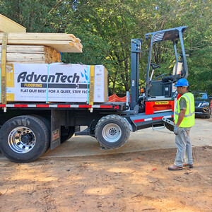 Off-loading truck-mounted forklift